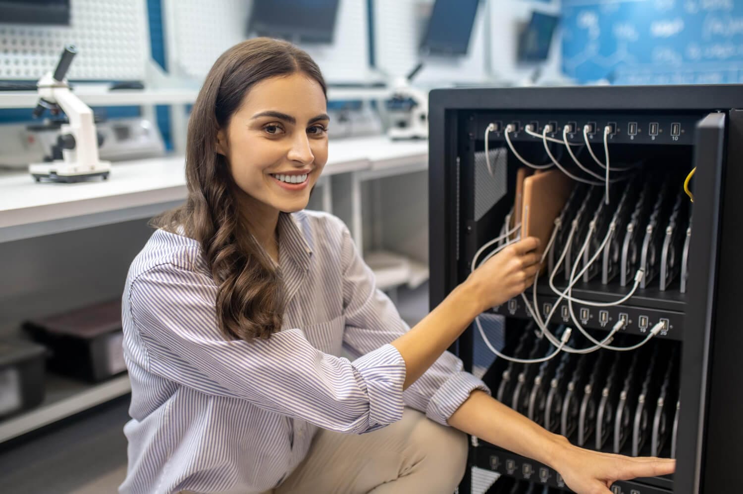 Woman Crouching Near Special Equipment Smiling Camera (1) (1)